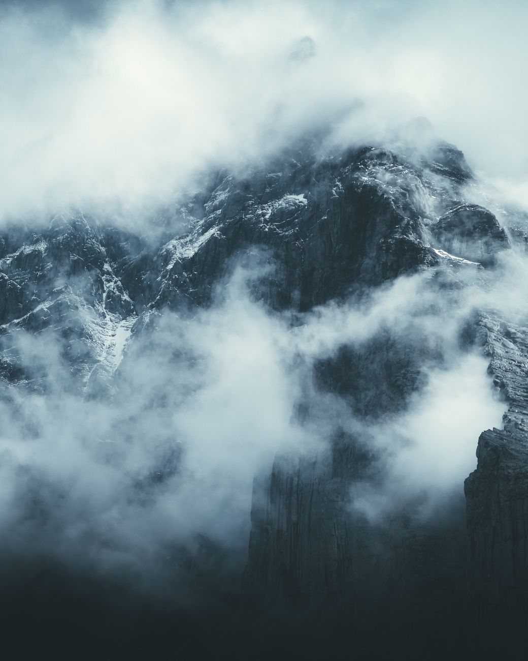 High limestone pinnacles in Dolomites fog