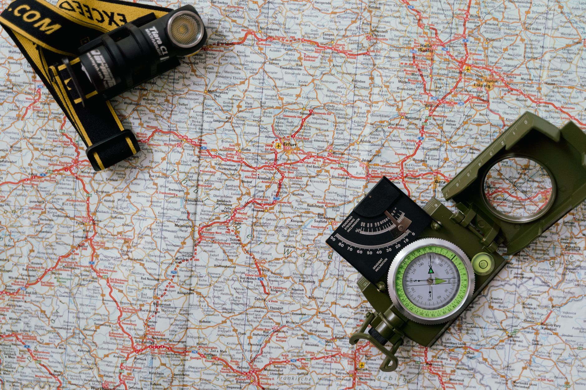 Hikers planning route over vintage map